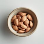 almonds, placed on a clean white background, evenly lit, professional food photography style, isolated with transp (1)